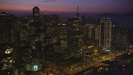 5K Aerial Video Flyby the downtown skyline, and reveal part of the Bay Bridge, San Francisco, California, night Aerial Stock Footage | DCSF10_070