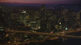 5K Aerial Video Flyby heavy traffic on the Bay Bridge by Downtown San Francisco, California, night Aerial Stock Footage | DCSF10_071