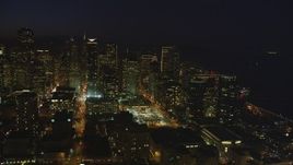 5K Aerial Video Heavy traffic on streets through downtown, reveal One Rincon Hill skyscraper, San Francisco, California, night Aerial Stock Footage | DCSF10_075