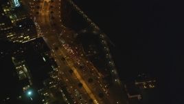 5K Aerial Video Fly by The Embarcadero and tilt up, Downtown San Francisco, California, night Aerial Stock Footage | DCSF10_076