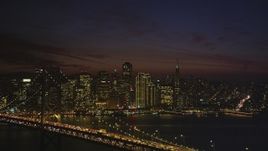 5K Aerial Video of Downtown San Francisco and the Bay Bridge at night, California Aerial Stock Footage | DCSF10_084