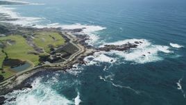 5K Aerial Video of Pacific Grove Municipal Golf Links and waves crashing on the coast by Ocean View Boulevard, Pacific Grove, California Aerial Stock Footage | DCSF11_003