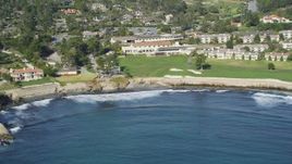 5K Aerial Video Tilt from the ocean to reveal Pebble Beach Golf Links and Pebble Beach Resorts, California Aerial Stock Footage | DCSF11_007