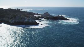 5K Aerial Video Tilt to reveal waves crashing into coastal rock formations, Carmel, California Aerial Stock Footage | DCSF11_013