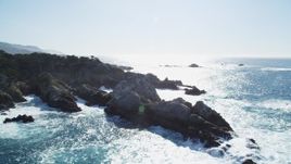 5K Aerial Video Flying by ocean waves crashing into coastal rock formations, Carmel, California Aerial Stock Footage | DCSF11_014