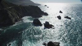 5K Aerial Video Approach waves rolling toward coastal rock formations, Big Sur, California Aerial Stock Footage | DCSF11_021