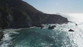 5K Aerial Video Flying by waves crashing into the base of coastal cliffs, Big Sur, California Aerial Stock Footage | DCSF11_023
