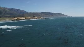 5K Aerial Video Fly over kelp in Pacific Ocean near the coastline and tilt down to the water, Big Sur, California Aerial Stock Footage | DCSF11_029