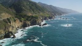 5K Aerial Video Following the coastline, waves crashing into rocks, Big Sur, California Aerial Stock Footage | DCSF11_037