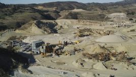 5K aerial stock footage of flying by a quarry and industrial equipment, Simi Valley, California Aerial Stock Footage | DFKSF01_002