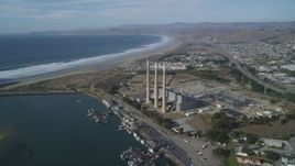 5K aerial stock footage of flying by the coastal Dynegy Power Plant with smoke stacks, Morro Bay, California Aerial Stock Footage | DFKSF03_008