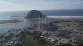 5K aerial stock footage of the Dynegy Power Plant with smoke stacks, reveal Morro Rock, Morro Bay, California Aerial Stock Footage | DFKSF03_009