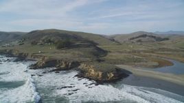 5K aerial stock footage of flying by Highway 1, pan to reveal coastal abalone farm, Cayucos, California Aerial Stock Footage | DFKSF03_016