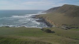 5K aerial stock footage of flying over a hill to follow the coastline, Harmony, California Aerial Stock Footage | DFKSF03_023