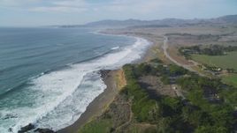 5K aerial stock footage of tilting from the ocean to follow coastline near Highway 1, Cambria, California Aerial Stock Footage | DFKSF03_045