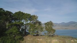 5K aerial stock footage of approaching the coastline from the Pacific Ocean, San Simeon, California Aerial Stock Footage | DFKSF03_059