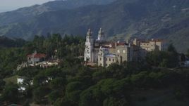 5K aerial stock footage of flying by the east side of iconic Hearst Castle, San Simeon, California Aerial Stock Footage | DFKSF03_064
