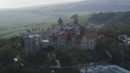 5K aerial stock footage of flying by the east and north side of historic Hearst Castle, San Simeon, California Aerial Stock Footage | DFKSF03_066