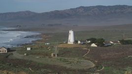 5K aerial stock footage of flying by Point Piedras Blancas lighthouse, San Simeon, California Aerial Stock Footage | DFKSF03_073