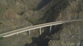 5K aerial stock footage of flying by a small bridge on Highway 1, above coastal cliffs, Big Sur, California Aerial Stock Footage | DFKSF03_089