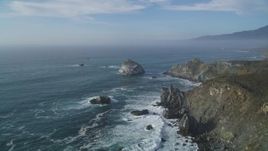 5K aerial stock footage of an approach to a large rock formation off the coast, Big Sur, California Aerial Stock Footage | DFKSF03_093