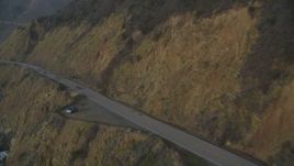 5K aerial stock footage of flying over coastal cliffs, revealing Highway 1 coastal road, Big Sur, California Aerial Stock Footage | DFKSF03_108