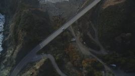 5K aerial stock footage of tracking a white car on Highway 1 coastal road, Big Sur, California Aerial Stock Footage | DFKSF03_113