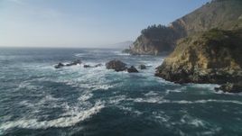 5K aerial stock footage of flying by coastal cliffs and over rock formations, Big Sur, California Aerial Stock Footage | DFKSF03_120