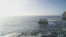 5K aerial stock footage of flying low over ocean past birds perched on rock formation, Big Sur, California Aerial Stock Footage | DFKSF03_124
