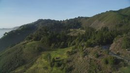 5K aerial stock footage of flying over hills, approaching Highway 1, Big Sur, California Aerial Stock Footage | DFKSF03_128