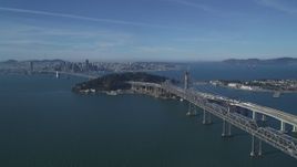 5K aerial stock footage approach Bay Bridge, Yerba Buena Island, with view of Downtown San Francisco, California Aerial Stock Footage | DFKSF05_009