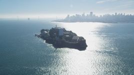 5K aerial stock footage of orbiting Alcatraz, with view of Bay Bridge and skyline, San Francisco, California Aerial Stock Footage | DFKSF05_028