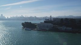 5K aerial stock footage flyby iconic Alcatraz, pan to skyline of Downtown San Francisco, California Aerial Stock Footage | DFKSF05_030