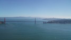 5K aerial stock footage of the iconic Golden Gate Bridge, city skyline in the background, San Francisco, California Aerial Stock Footage | DFKSF05_056