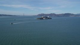 5K aerial stock footage of iconic Alcatraz with a view of the famous Golden Gate Bridge, San Francisco, California Aerial Stock Footage | DFKSF05_068