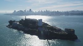 5K aerial stock footage orbit historic Alcatraz prison with views of the city skyline, Downtown San Francisco, California Aerial Stock Footage | DFKSF05_071