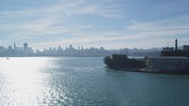 5K aerial stock footage of flying by famous Alcatraz prison with views of skyline, Downtown San Francisco, California Aerial Stock Footage | DFKSF05_072
