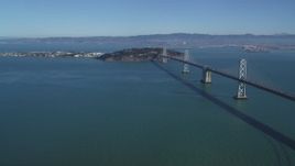 5K aerial stock footage of a view of the Bay Bridge, Yerba Buena Island, Treasure Island in San Francisco, California Aerial Stock Footage | DFKSF05_086