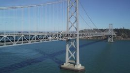 5K aerial stock footage of flying by the Bay Bridge with light traffic, San Francisco, California Aerial Stock Footage | DFKSF05_089