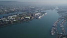 5K aerial stock footage of flying by Coast Guard Island, Oakland, California Aerial Stock Footage | DFKSF05_096