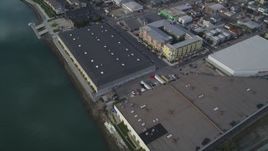 5K aerial stock footage bird's eye of factories, warehouses, apartment buildings between bridges, Oakland Estuary, California Aerial Stock Footage | DFKSF06_004