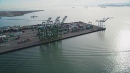 5K aerial stock footage of orbiting the cargo cranes and shipping containers at the Port of Oakland, California Aerial Stock Footage | DFKSF06_020