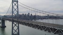 5K aerial stock footage track light Bay Bridge traffic with views of the skyline, San Francisco, California Aerial Stock Footage | DFKSF06_023