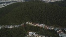 5K aerial stock footage fly over hillside homes and forest near Mount Sutro, San Francisco, California Aerial Stock Footage | DFKSF06_072