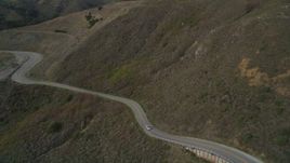 5K aerial stock footage of flying over Highway 1 at the base of mountains, Marin County, California Aerial Stock Footage | DFKSF06_108