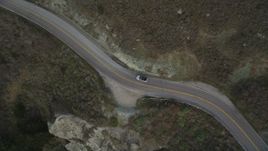 5K aerial stock footage of a bird's eye view of a silver convertible on Highway 1, Marin County, California Aerial Stock Footage | DFKSF06_111