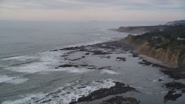 5K aerial stock footage of flying by ocean waves near coastal cliffs, Bolinas, California Aerial Stock Footage | DFKSF06_116