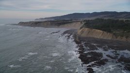 5K aerial stock footage of flying past waves near coastal cliffs, Bolinas, California Aerial Stock Footage | DFKSF06_117