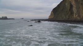 5K aerial stock footage of flying low over ocean panning across coastal cliffs to reveal rock formations, Bolinas, California Aerial Stock Footage | DFKSF06_130