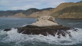 5K aerial stock footage of circling a rock formation and ascending toward coastline, Bolinas, California Aerial Stock Footage | DFKSF06_132